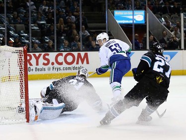 Bo Horvat #53 of the Vancouver Canucks scores a goal on Martin Jones #31 of the San Jose Sharks at SAP Center on March 31, 2016 in San Jose, California.  (Photo by Ezra Shaw/Getty Images)