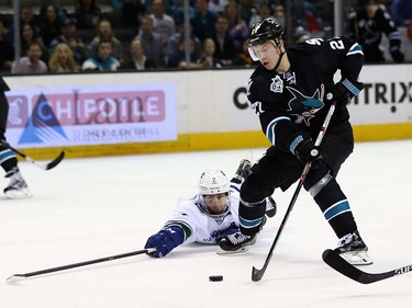 Dan Hamhuis #2 of the Vancouver Canucks dives to try to stop Joonas Donskoi #27 of the San Jose Sharks at SAP Center on March 31, 2016 in San Jose, California.  (Photo by Ezra Shaw/Getty Images)