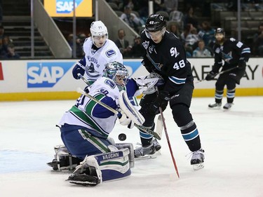 Ryan Miller #30 of the Vancouver Canucks makes a save on a shot taken by Tomas Hertl #48 of the San Jose Sharks at SAP Center on March 31, 2016 in San Jose, California.  (Photo by Ezra Shaw/Getty Images)