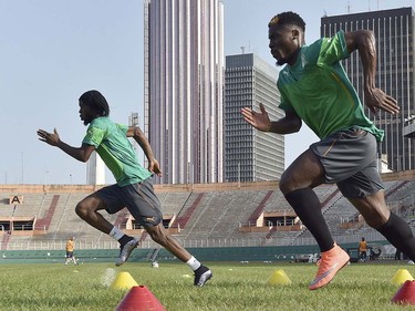 Ivory Coast's Serge Aurier (R) and Gervinho (L) take part in a training session at the Felix Houphouet-Boigny stadium in Abidjan on March 23, 2016, ahead of the 2017 Africa Cup Nations football match between Ivory Coast and Sudan. ISSOUF SANOGO/AFP/Getty Images