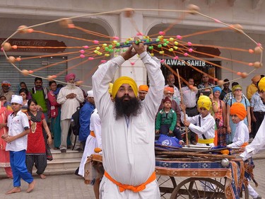 An Indian Sikh demonstrates 'Gatka' martial arts skills during a procession to mark 'Hola Mohalla' at The Golden Temple in Amritsar on March 24, 2016.  Hola Mohalla is a three day Sikh festival, in which Nihang Sikh 'warriors' perform Gatka (mock encounters with real weapons), tent pegging and bareback horse-riding, following the Hindu festival of Holi. NARINDER NANU/AFP/Getty Images