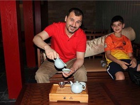 Canadian Salim Alaradi and his son, Mohamed Alaradi are shown on a family vacation in the United Arab Emirates in a 2013 family handout photo.