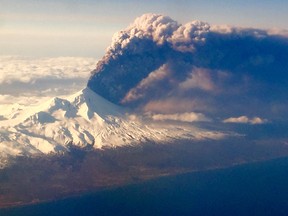 In this Sunday, March 27, 2016, photo, Mount Pavlof, one of Alaska's most active volcanoes, erupts, sending a plume of volcanic ash into the air.