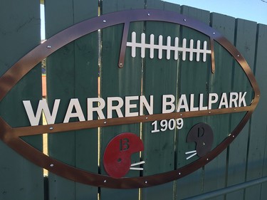 A sign on the outfield fence of the Warren Ball park.