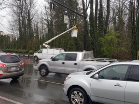 See that 'worker' in the bucket? He's an RCMP officer spotting distracted drivers at Capilano Road and Marine Drive in North Vancouver on Wednesday.