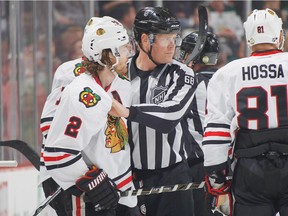 ST. PAUL, MN - MARCH 29: Duncan Keith #2 of the Chicago Blackhawks is escorted off the ice after being given a match penalty against the Minnesota Wild during the game on March 29, 2016 at the Xcel Energy Center in St. Paul, Minnesota.