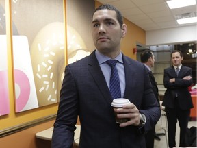 Former mixed martial arts champion Chris Weidman talks to reporters at the state legislature in Albany, N.Y. — The Associated Press files