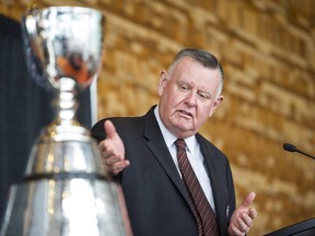 B.C. Lions owner David Braley with the Grey Cup championship trophy during a September 2014 event in Vancouver.