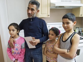 Amjad Ktifan with his children Saja, 10, Ritaj, 8, and Maan, 11, at their home in Delta.