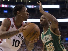 The Toronto Raptors' DeMar DeRozan (left) in action agains Marcus Smart and his Boston Celtics. (Chris Young, Canadian Press)