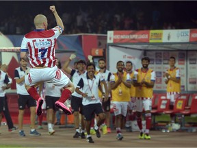 Atletico-de-Kolkata's forward Iain Hume celebrates after scoring from a penalty against FC Goa during the Indian Super League match at The Saltlake Stadium in Kolkata on Nov. 22, 2015.