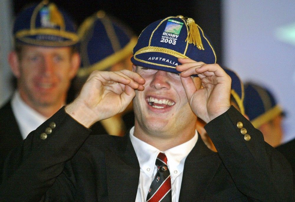 Canadian center John Cannon smiles as he dons a ceremonial during a team welcome function and capping ceremony in Melbourne, 09 October 2003. Canada will play Wales in their first rugby world cup game in Melbourne, 12 October. AFP PHOTO/Peter PARKS (Photo credit should read PETER PARKS/AFP/Getty Images)