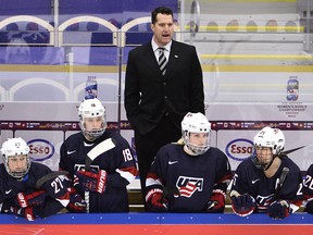 Ken Klee stands behind his U.S. players during the 2015 IIHF women's world championship semifinal match against Russia in Malmo, Sweden. — Getty Images files