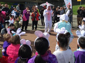 Big Bunny Baxter Bayer leads the young ones through a hip-hop warm-up during Sunday's inaugural Easter Fun Run at Stanley Park.