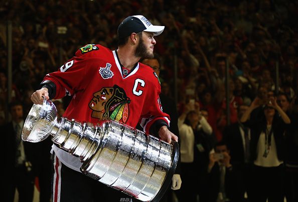  Jonathan Toews of the Chicago Blackhawks holds the Stanley Cup after the Blachawks defeated the Tampa Bay Lightning 2-0 in Game Six of the 2015 NHL Stanley Cup Final at the United Center on June 15, 2015 in Chicago, Illinois. (Photo by Dave Sandford/NHLI via Getty Images)