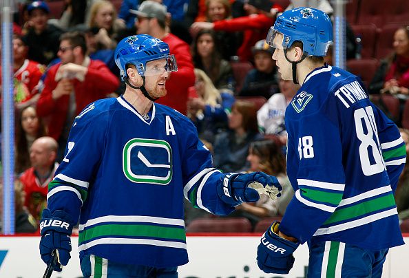 aniel Sedin #22 talks strategy with Nikita Tryamkin #88 of the Vancouver Canucks during their NHL game against the Chicago Blackhawks at Rogers Arena March 27, 2016 in Vancouver, British Columbia, Canada. (Photo by Jeff Vinnick/NHLI via Getty Images)