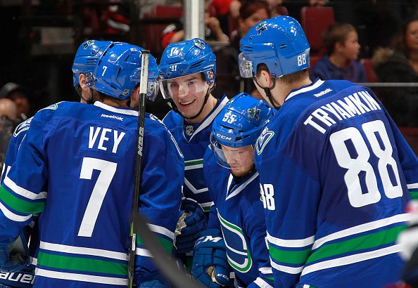  Alexandre Burrows #14 of the Vancouver Canucks is congratulated after scoring against the Chicago Blackhawks during their NHL game at Rogers Arena March 27, 2016 in Vancouver, British Columbia, Canada. (Photo by Jeff Vinnick/NHLI via Getty Images)