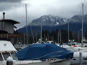 There's still fresh snow accumulating on them there mountains, Sunday, March 13, at the start of SportMedBC's Sun Run InTraining clinic at the Coal Harbour Community Centre.