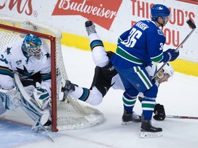 Vancouver Canucks winger Jannik Hansen (right), driving past the San Jose Sharks net on Tuesday, gets another crack at the Sharks tonight in San Jose, Calif.