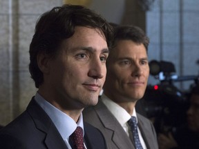 Prime Minister Justin Trudeau and Vancouver Mayor Gregor Robertson take part in a news conference in the Foyer of the House of Commons on Parliament Hill in Ottawa Friday, February 5, 2016. The Trudeau government is poised to deliver a big city-friendly budget Tuesday that is expected to provide a major financial boost to proposed rapid transit projects in Vancouver and Surrey.