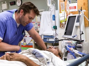 VGH emergency medicine Dr. Andrew Campbell with a patient in a scene from season 2 of the Knowledge Network series, Emergency Room: Life and Death at VGH