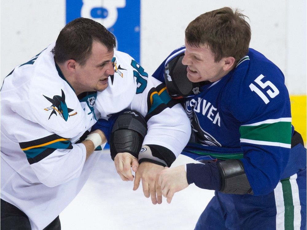 San Jose Sharks' Michael Haley, left, and Vancouver Canucks' Derek Dorsett fight during the second period of an NHL hockey game in Vancouver, B.C., on Thursday March 3, 2016.