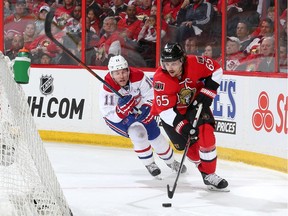 OTTAWA, ON - APRIL 19: Erik Karlsson #65 of the Ottawa Senators skates with the puck against Brendan Gallagher #11 of the Montreal Canadiens in Game Three of the Eastern Conference Quarterfinals during the 2015 NHL Stanley Cup Playoffs at Canadian Tire Centre on April 19, 2015 in Ottawa, Ontario, Canada.