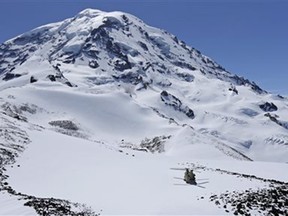 Crews are working to rescue two climbers and a snowshoer after they were caught in a weekend storm on Mount Rainier.