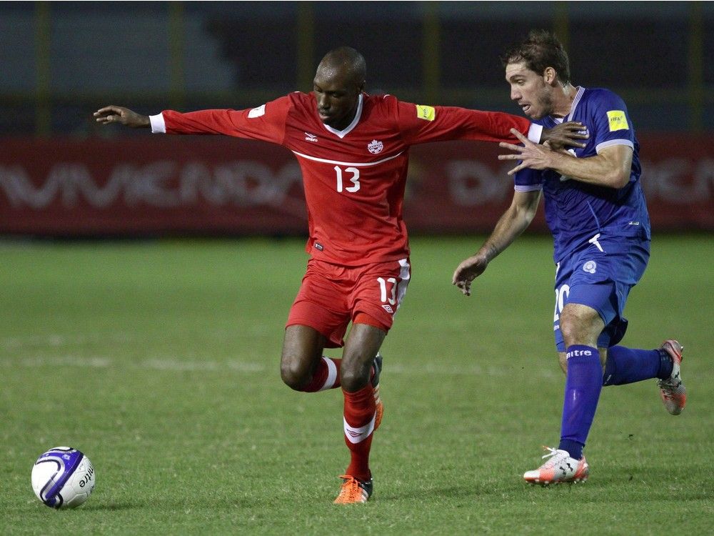 Canada's Atiba Hutchinson, left, vies for the ball with El Salvador's Pablo Punyed during a 2018 World Cup qualifying soccer match in San Salvador, El Salvador, on Nov. 17, 2015. Canada hosts powerhouse Mexico in a crucial World Cup qualifier on Friday, a game the veteran midfielder says could not only vault the men's national team closer to the 2018 tournament, but change how the program is viewed as a whole.