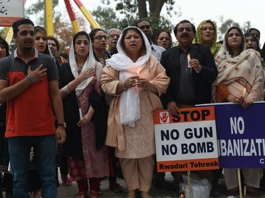 Pakistani civil society members sing the national anthem at the site of a suicide blast in Lahore on March 28, 2016. Pakistan's army launched raids and arrested suspectsafter a Taliban suicide bomber targeting Christians over Easter killed 72 people including many children in a park crowded with families.