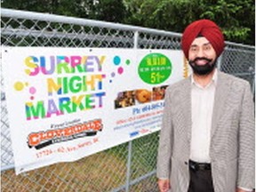 Satbir Singh Cheema, a director of Surrey Night Market, stands at the market entrance at Cloverdale Fairgrounds.