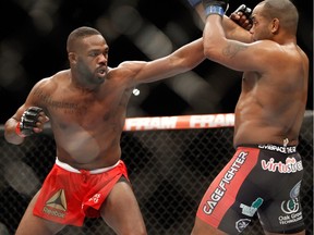 Jon Jones jabs at Daniel Cormier at UFC 182 on Jan. 3, 2015 in Las Vegas, Nevada. Jones retained his title by unanimous decision. — Getty Images files