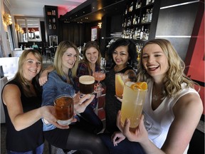 The UVA Wine & Cocktail Bar in the Moda Hotel is a great place to unwind during Happy Hour, just ask servers, left to right, Kelly Heward, Olivia Povarchook, Jasmine Radu, Lily Duong and Sabrine Dhaliwal.