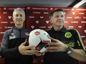 Canada's head coach Benito Floro and Mexico coach Juan Carlos Osorio, right, get set to square off this Friday with more than 50,000 soccer fans expected at BC Place Stadium in Vancouver.