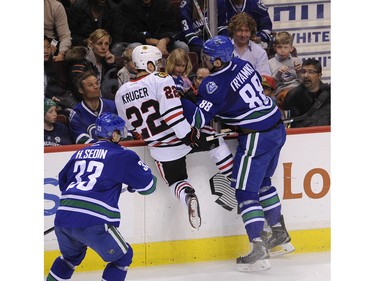 Vancouver Canucks Nikita Tryamkin    88, battles the Chicago Blackhawks Marcus Kruger   22 in Rogers Arena  in Vancouver on March 27, 2016.       Mark van Manen /PNG Staff photographer   see Iain MacIntyre Vancouver Sun Jason Botchford Province Sports  News /and Web. stories.   Nikita Tryamkin     00042415A [PNG Merlin Archive]