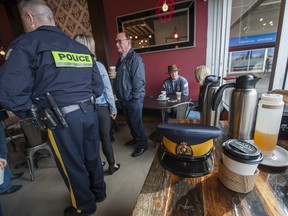 Surrey RCMP officers had coffee with residents Thursday as part of a program that aims to increase familiarity between civilians and police. Arlen Redekop/PNG