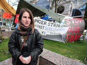 Kristin Henry talks to a reporter Sunday outside B.C. Hydro headquarters in downtown Vancouver. Nick Procaylo/PNG