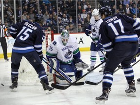 Goalie Jacob Markstrom of the Vancouver Canucks stops one of the 48 shots fired his way in a 2-0 loss to the Winnipeg Jets on Tuesday in the Manitoba capital.