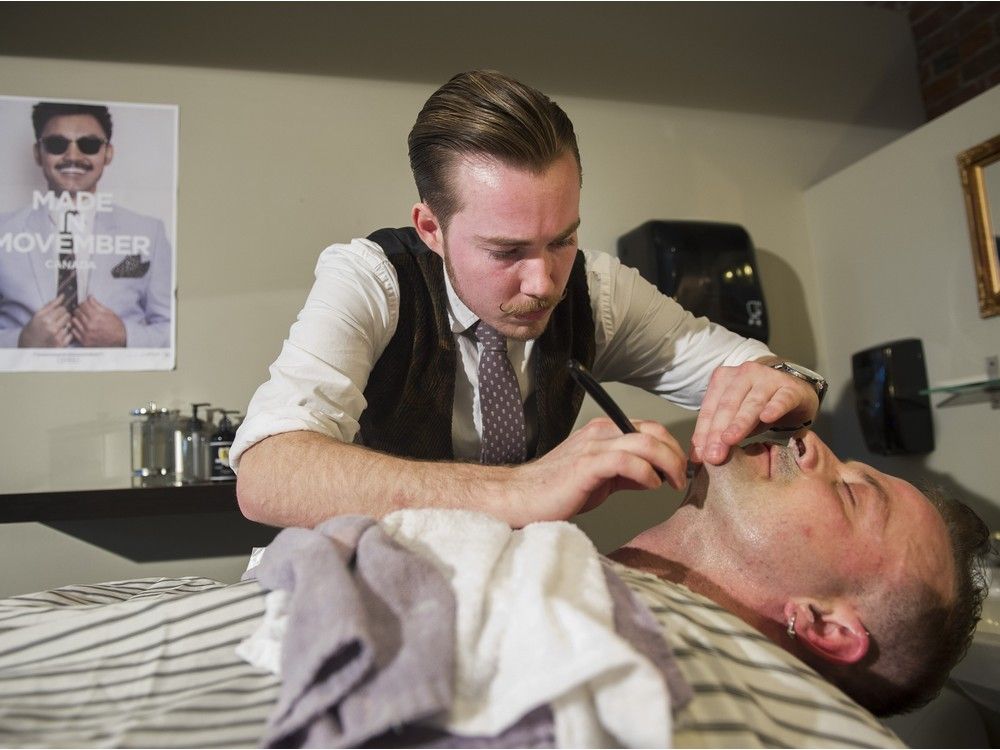VANCOUVER March 23 2016. Nate Shields gives Clay Dukart a straight-razor shave at the London School of Hairdressing barbering program, Vancouver March 23 2016. Gerry Kahrmann / PNG staff photo) / PNG staff photo) ( For Prov / Sun News ) 00042373A [PNG Merlin Archive]