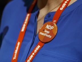 Former MP Megan Leslie speaks, wearing a supportive button, for the Leap Manifesto during the Edmonton 2016 NDP national convention at the Shaw Conference Centre on April 10.