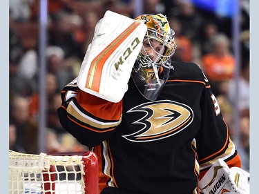 ANAHEIM, CA - APRIL 01:  John Gibson #36 of the Anaheim Ducks reacts after a shot to his mask during the second period against the Vancouver Canucks at Honda Center on April 1, 2016 in Anaheim, California.  (Photo by Harry How/Getty Images)