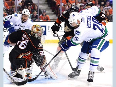 ANAHEIM, CA - APRIL 01:  John Gibson #36 of the Anaheim Ducks makes a save on Chris Higgins #20 of the Vancouver Canucks during the second period at Honda Center on April 1, 2016 in Anaheim, California.  (Photo by Harry How/Getty Images)