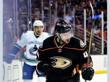 ANAHEIM, CA - APRIL 01:  Nate Thompson #44 of the Anaheim Ducks celebrates his goal to take a 2-1 lead in front of Emerson Etem #26 of the Vancouver Canucks during the third period at Honda Center on April 1, 2016 in Anaheim, California.  (Photo by Harry How/Getty Images)
