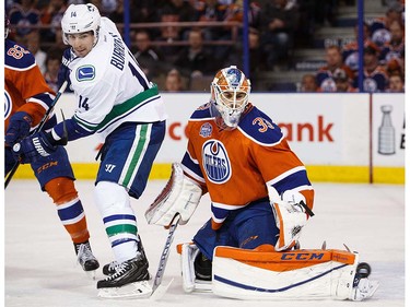 Goaltender Cam Talbot of the Edmonton Oilers makes a save on Alexandre Burrows #14 of the Vancouver Canucks on April 6, 2016 at Rexall Place in Edmonton, Alberta, Canada. The game is the final game the Oilers will play at Rexall Place before moving to Rogers Place next season. (Photo by Codie McLachlan/Getty Images)