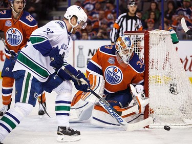 Goaltender Cam Talbot of the Edmonton Oilers makes a save on Daniel Sedin #22 of the Vancouver Canucks on April 6, 2016 at Rexall Place in Edmonton, Alberta, Canada. The game is the final game the Oilers will play at Rexall Place before moving to Rogers Place next season. (Photo by Codie McLachlan/Getty Images)