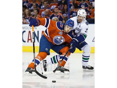 Leon Draisaitl #29 of the Edmonton Oilers battles with Daniel Sedin #22 of the Vancouver Canucks on April 6, 2016 at Rexall Place in Edmonton, Alberta, Canada. The game is the final game the Oilers will play at Rexall Place before moving to Rogers Place next season. (Photo by Codie McLachlan/Getty Images)