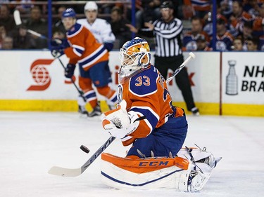 Goaltender Cam Talbot of the Edmonton Oilers makes a save against the Vancouver Canucks on April 6, 2016 at Rexall Place in Edmonton, Alberta, Canada. The game is the final game the Oilers will play at Rexall Place before moving to Rogers Place next season. (Photo by Codie McLachlan/Getty Images)