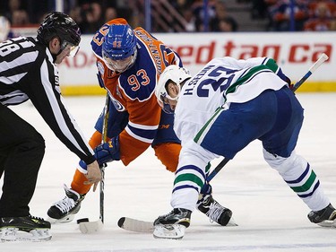 Ryan Nugent-Hopkins #93 of the Edmonton Oilers faces off against Henrik Sedin #33 of the Vancouver Canucks on April 6, 2016 at Rexall Place in Edmonton, Alberta, Canada. The game is the final game the Oilers will play at Rexall Place before moving to Rogers Place next season. (Photo by Codie McLachlan/Getty Images)