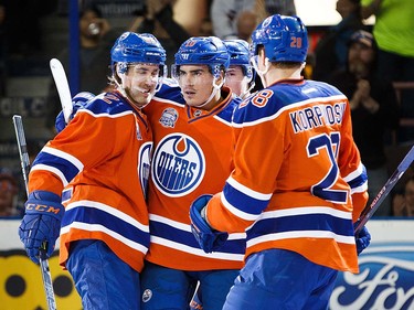 Jordan Oesterle #82, Nail Yakupov #10 and Lauri Korpikoski #28 of the Edmonton Oilers celebrate Yakupov's goal against the Vancouver Canucks on April 6, 2016 at Rexall Place in Edmonton, Alberta, Canada. The game is the final game the Oilers will play at Rexall Place before moving to Rogers Place next season. (Photo by Codie McLachlan/Getty Images)