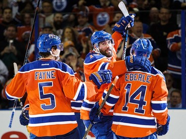 Mark Fayne #5, Patrick Maroon #19 and Jordan Eberle #14 of the Edmonton Oilers celebrate a goal against the Vancouver Canucks on April 6, 2016 at Rexall Place in Edmonton, Alberta, Canada. The game is the final game the Oilers will play at Rexall Place before moving to Rogers Place next season. (Photo by Codie McLachlan/Getty Images)